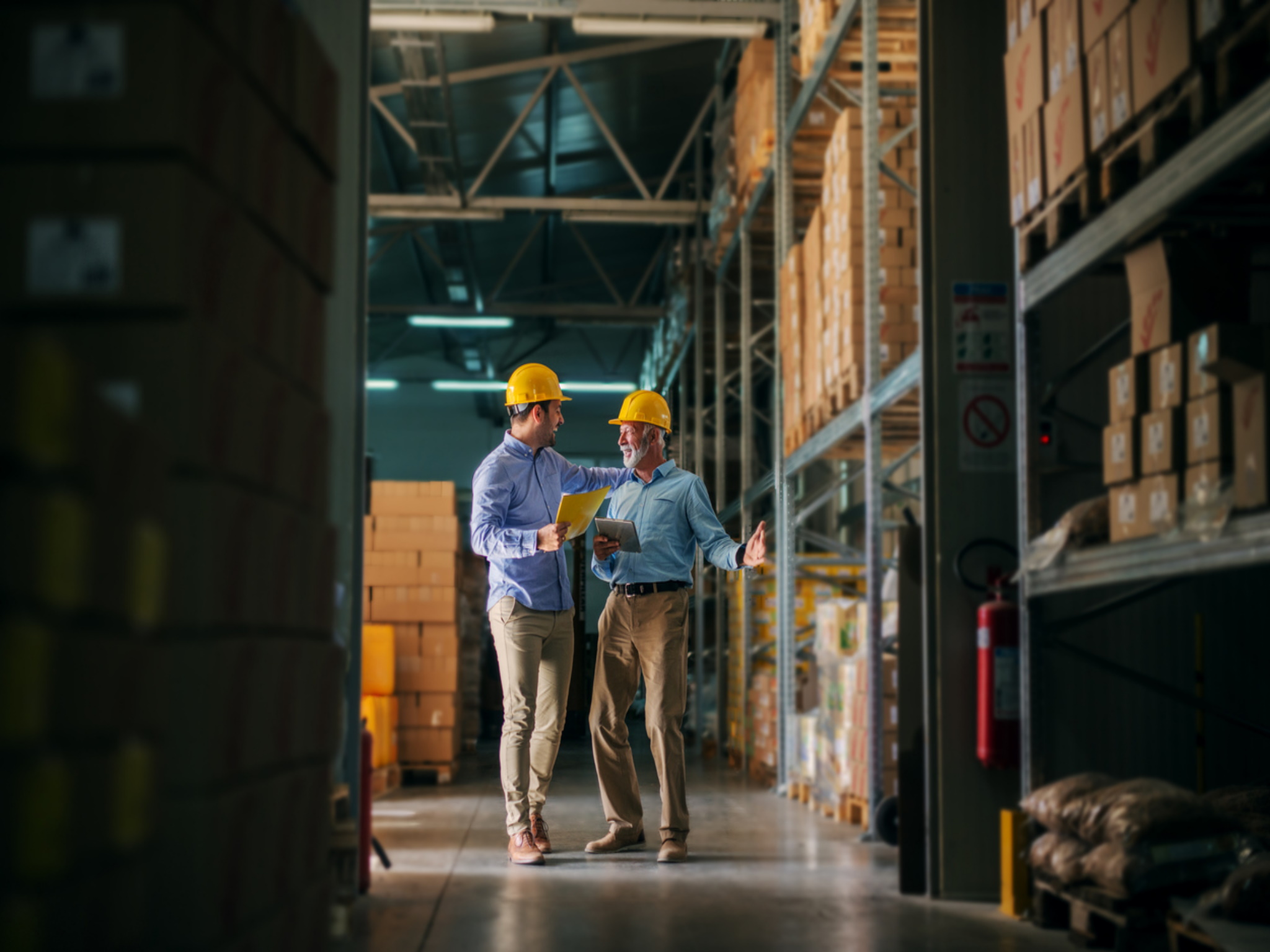 two manufacturing managers in warehouse